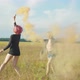 Women Swinging with Colored Smoke Bombs Outdoors - VideoHive Item for Sale
