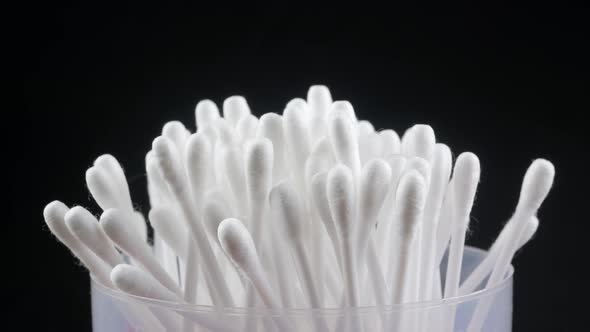 White cotton-tipped swabs. Ear sticks close up. alt