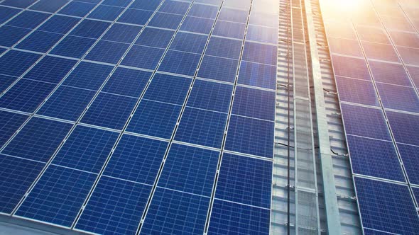 Aerial cinematic view of a solar panel on mall roof top alt