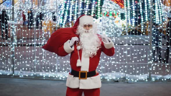 Santa Claus is Dancing Funny at the Christmas Fair
