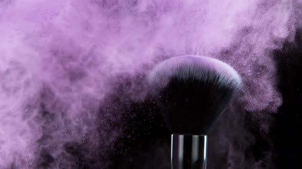 Super Slow Motion Shot of Makeup Brush and Purple Powder Shake at 1000 Fps alt