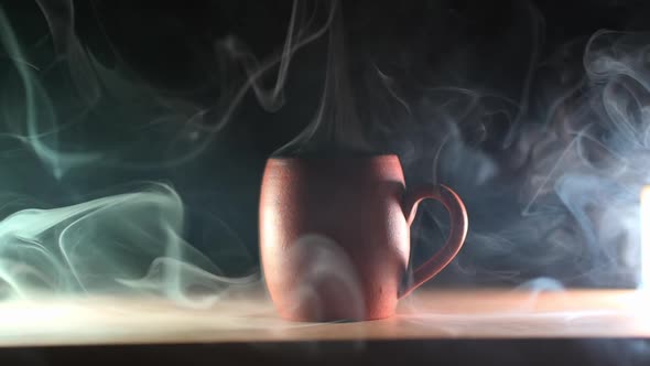 Aromatic coffee. beautiful ceramic mug with an invigorating drink on a dark background alt