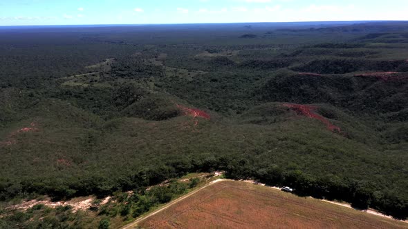 Flying over the natural landscape of the Brazilian savannah then over fields deforested for soybean alt