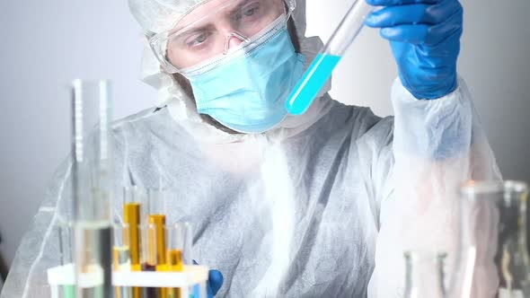 scientist in protective clothing in lab chemical experiments biological material alt