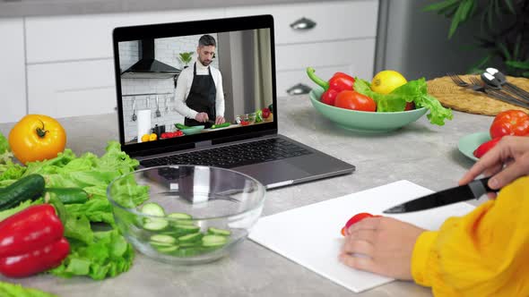Man Food Blogger in Laptop Screen Tells Teaches Housewife Remote Cooking Course alt