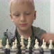 Cute Little Boy Playing Chess at Home - VideoHive Item for Sale