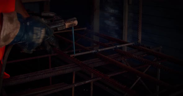 Slow Motion. Welder Welding The Worker Performs Metal Welding at the Factory or Construction Site alt