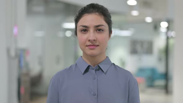 Portrait of Young Indian Woman Looking Towards Camera alt
