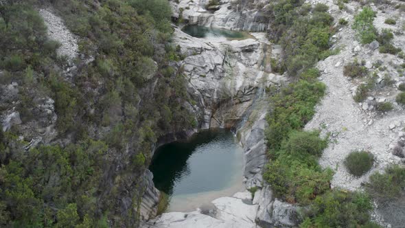 Aerial descending view over natural lagoons, Sete lagoas trail, Gerês National Park