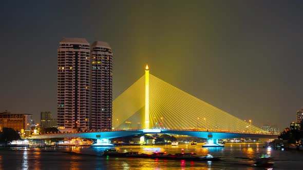 time lapse of Somdet Phra Pinklao Bridge over the Chao Phraya River at night in Bangkok, Thailand