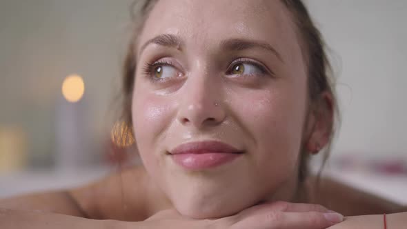 Headshot Portrait of Smiling Charming Confident Slim Woman Posing in Bathtub at Home in Slow Motion alt