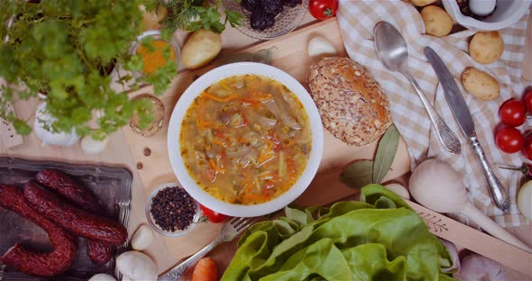 Fresh Meal Served In Bowl By Bread With Pumpkin Seeds alt