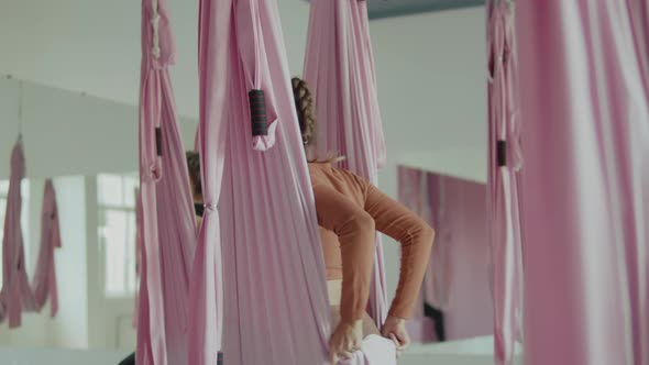 Woman Using A Hammock In Aerial Yoga Class