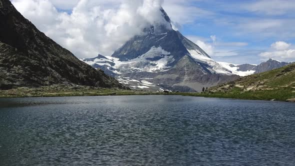 Time-lapse snowy Matterhorn peak and lake Stellisee, Swiss Alps, Zermatt