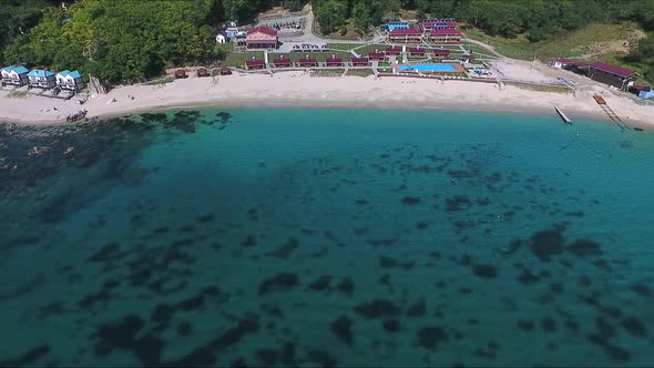 Flying Over the Blue Sea Surface in the Azure Lagoon alt