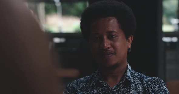 Young man listening and enjoying dinner date alt