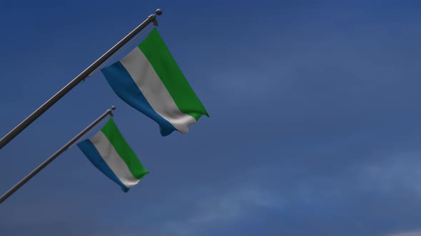 Sierra Leone Flags In The Blue Sky - 4K