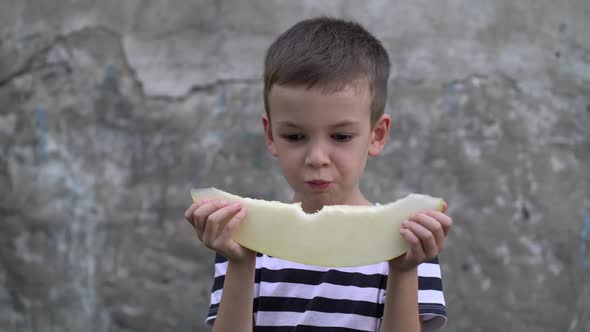 Portrait of Preschooler Eating Fresh Melon