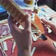 Hands of Man Adjusts Plywood Details for Ship Model Grinding on Sandpaper - VideoHive Item for Sale