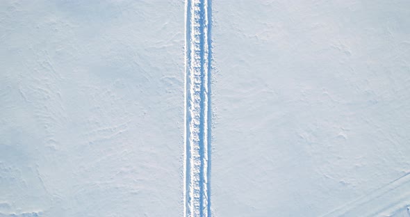 Snowmobile Tracks In The Snow