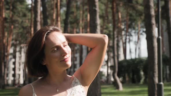 Portrait of woman in park alt
