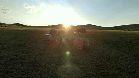 Central Asian Family People Walking Immigrating With Traditional Old Oxcart Tumbrel And Tumbril Cart alt