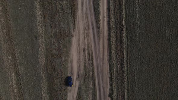 Top View of a Car Driving on a Dusty Road of Kakheti Region of Georgia alt