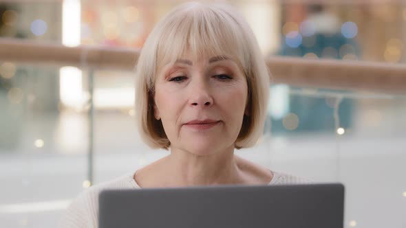 Headshot Focused Successful Mature Businesswoman Entrepreneur Working on Laptop Typing Article alt