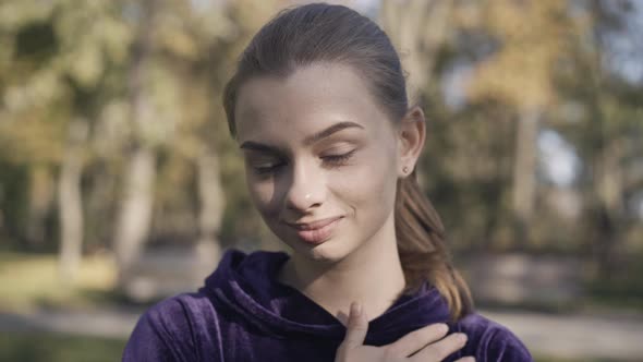 Closeup of Charming Beautiful Woman Flirting with Camera in Sunlight alt