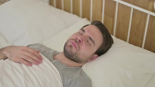 Beard Young Man Wake Up From the Bed alt