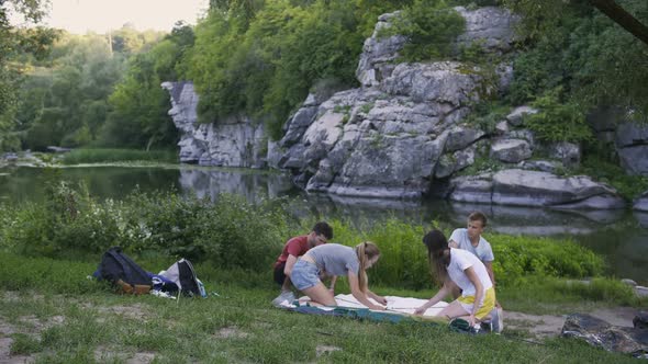 Timelapse of Friends Putting Up a Tent in Campsite alt