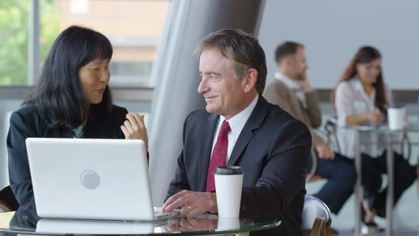 Groups of business people meeting, rack focus