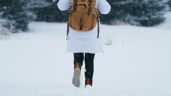 Slow Motion Woman Walking in Winter Boots By Fresh White Snow Snowy Winter Day alt
