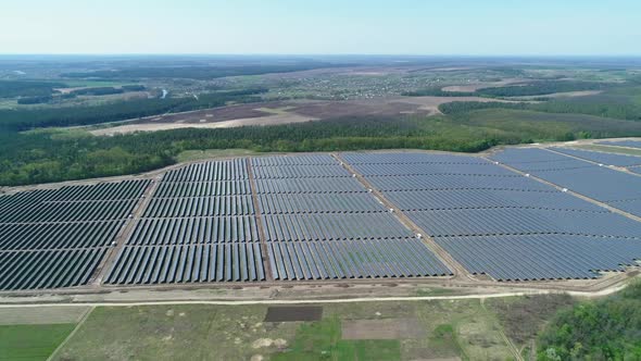Aerial View of Solar Power Station Field at Sunny Day. Aerial Top View of Solar Farm. Renewable alt