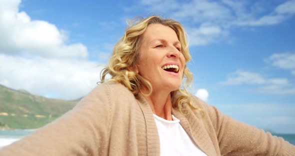 Beautiful woman enjoying on beach alt