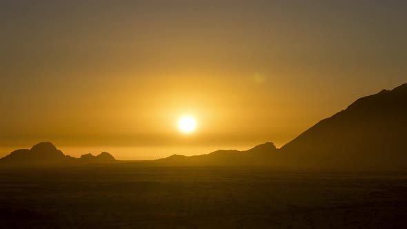 Stunning Sunset With Golden Skies Behind The Magnificent Mountains Of Spitzkoppe, Namiba. - Timelaps alt