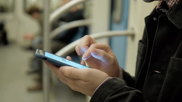 Young Handsome Businessman with Smartphone in Subway, Man Student in Underground Railway Station alt