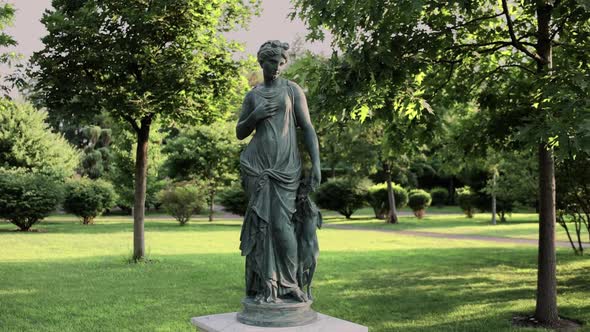 beautiful statue of a woman in the courtyard of the garden