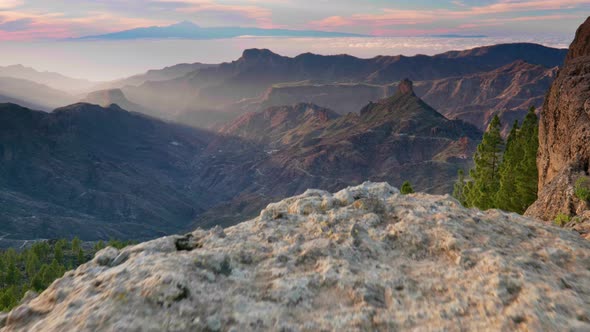 Nature of Gran Canaria Island. Sunset View From Roque Nublo Point. Tenerife Island Visible in the alt