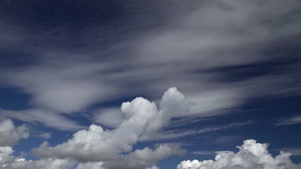 Cumulus clouds fast flying sky timelapse.