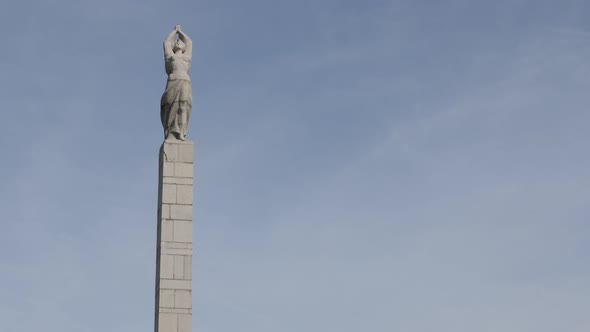 VIDIN, BULGARIA - OCTOBER 10, 2017 Western Bulgarian town sculpture on column slow tilting footage