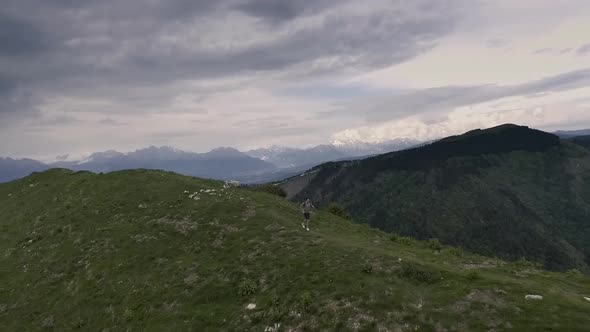 Athletic man running on the mountains