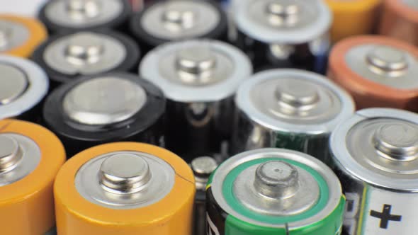 Various Close Up Background of Various Alkaline Batteries alt