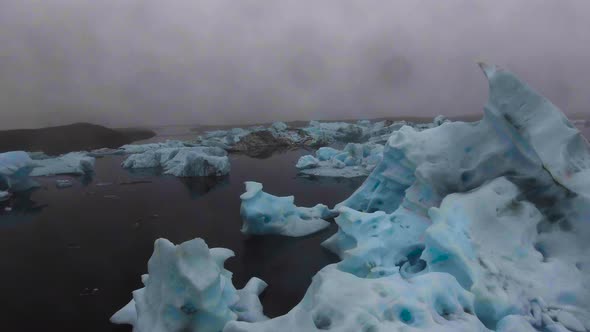 Drone Aerial View of Icebergs in Jokulsarlon Glacial Lagoon in Iceland alt