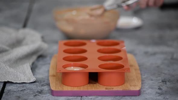 Pouring Chocolate Mousse Into Silicone Molds