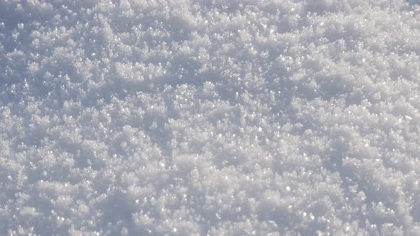 Milky white snow crystals close-up 4K 2160p 30fps UltraHD tilting footage - Sparkling  frozen crysta alt