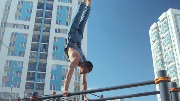 A man exercising on a sports ground