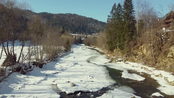 Drone View of Mountain River in Winter alt