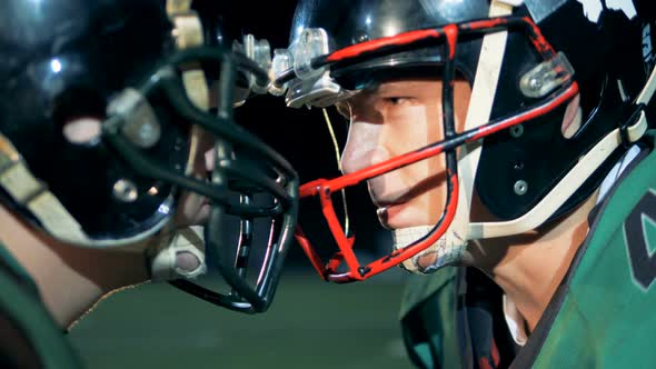 American Football Players, Athletes Stand Head To Head, Side View. alt