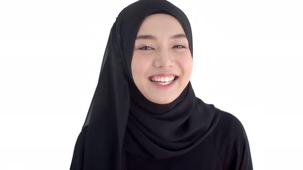 Portrait beautiful Muslim woman wearing traditional clothing touch on cheek